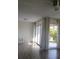 Bright room with large glass patio doors leading to an enclosed lanai at 3314 Mcdill Rd # 3314, Bradenton, FL 34207