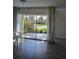 A naturally lit living room with large glass patio doors to the lanai at 3314 Mcdill Rd # 3314, Bradenton, FL 34207
