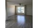 Bright living room featuring tile flooring, large window, and white walls at 3314 Mcdill Rd # 3314, Bradenton, FL 34207