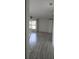 Open-concept living room with large windows and modern flooring, creating a bright and airy space at 3314 Mcdill Rd # 3314, Bradenton, FL 34207