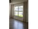Bright living room with large window and hardwood-style flooring at 3314 Mcdill Rd # 3314, Bradenton, FL 34207