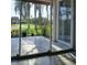 Covered patio featuring tile flooring, palm trees, and landscaping at 3314 Mcdill Rd # 3314, Bradenton, FL 34207