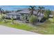 Elegant single-story home featuring lush landscaping and an over-sized lawn at 3607 Darin Dr, Punta Gorda, FL 33950