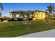 Charming one-story home with manicured landscaping and palm trees at 3607 Darin Dr, Punta Gorda, FL 33950