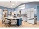 Spacious kitchen featuring modern appliances, white cabinetry, and a large kitchen island at 3607 Darin Dr, Punta Gorda, FL 33950