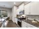 Stylish kitchen featuring granite countertops, stainless steel appliances, and natural light at 5203 Lake Overlook Ave, Bradenton, FL 34208