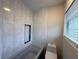 Bathroom featuring a shower/tub combo and tiled wall at 1007 Longfellow Cir, Sarasota, FL 34243