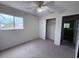 Bedroom with a window, carpeted floors and a closet at 1007 Longfellow Cir, Sarasota, FL 34243