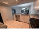 Bright kitchen with stainless steel appliances and a view through the window over the sink at 1007 Longfellow Cir, Sarasota, FL 34243