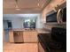Bright kitchen with stainless steel appliances and a view through the window over the sink at 1007 Longfellow Cir, Sarasota, FL 34243