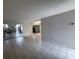 Open floor plan with living room featuring tile floors and access to the outdoor patio at 1007 Longfellow Cir, Sarasota, FL 34243