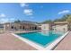 Community pool with plenty of seating on a sunny day at 1007 Longfellow Cir, Sarasota, FL 34243
