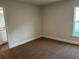 Bedroom with neutral carpet and a window overlooking the yard at 2648 Averland Loop, North Port, FL 34287