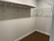 Walk-in closet with wire shelving and carpeted floor at 2648 Averland Loop, North Port, FL 34287