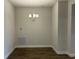 Bright dining room features modern chandelier and wood-look tile floor at 2648 Averland Loop, North Port, FL 34287