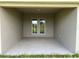 Covered lanai with view to the backyard, offers a perfect spot for relaxation and outdoor enjoyment at 2648 Averland Loop, North Port, FL 34287