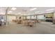 Spacious community room with ample seating, tables, and natural light, perfect for social gatherings at 4600 Gulf Of Mexico Dr # 206, Longboat Key, FL 34228
