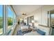 Relaxing sunroom with comfortable seating, natural light, and serene outdoor views at 4600 Gulf Of Mexico Dr # 206, Longboat Key, FL 34228