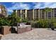 Community barbecue area with stainless grill and ample counter space at 5740 Midnight Pass Rd # 307, Sarasota, FL 34242