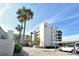 Condo building with tropical landscaping, convenient parking and a serene atmosphere at 5740 Midnight Pass Rd # 307, Sarasota, FL 34242