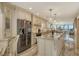 Modern kitchen with stainless steel appliances and a center island at 5740 Midnight Pass Rd # 307, Sarasota, FL 34242