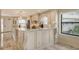 Modern, recently updated kitchen with marble floors, granite counters, and stainless steel appliances at 5740 Midnight Pass Rd # 307, Sarasota, FL 34242