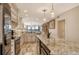 Bright kitchen offering granite counters, stainless appliances, and a serene view at 5740 Midnight Pass Rd # 307, Sarasota, FL 34242