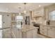 Open kitchen with granite countertops, stainless appliances, and modern lighting at 5740 Midnight Pass Rd # 307, Sarasota, FL 34242
