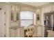 Charming kitchen nook featuring granite counters, a window, and custom cabinets at 5740 Midnight Pass Rd # 307, Sarasota, FL 34242