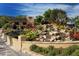 Beautifully landscaped grounds with rock waterfall feature at Gulf & Bay Club at 5740 Midnight Pass Rd # 307, Sarasota, FL 34242