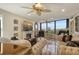 Elegant living room featuring fireplace, ocean view, and stylish decor at 5740 Midnight Pass Rd # 307, Sarasota, FL 34242