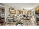Spacious living room with elegant furniture and a view into the kitchen at 5740 Midnight Pass Rd # 307, Sarasota, FL 34242