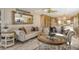 Living area with comfortable seating and elegant decor at 5740 Midnight Pass Rd # 307, Sarasota, FL 34242