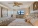 Bright main bedroom featuring a decorative dresser, artwork, and plenty of natural light at 5740 Midnight Pass Rd # 307, Sarasota, FL 34242