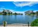 Expansive pond view featuring a central fountain, pedestrian bridge, and lush tropical surroundings at 5740 Midnight Pass Rd # 307, Sarasota, FL 34242