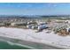 Panoramic aerial view of the condo community, oceanfront location, and the city beyond at 5830 Midnight Pass Rd # 502, Sarasota, FL 34242