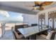 Inviting balcony with comfortable seating and a decorative ceiling fan, perfect for enjoying ocean views at 5830 Midnight Pass Rd # 502, Sarasota, FL 34242