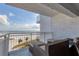 Relax on the balcony with comfortable seating and breathtaking ocean views at 5830 Midnight Pass Rd # 502, Sarasota, FL 34242