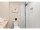 Modern bathroom with a glass-enclosed shower and stylish white tile at 5830 Midnight Pass Rd # 502, Sarasota, FL 34242