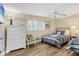 Comfortable bedroom features two twin beds, natural light and hardwood floors at 5830 Midnight Pass Rd # 502, Sarasota, FL 34242