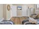 Bright bedroom features two twin beds and beach decor at 5830 Midnight Pass Rd # 502, Sarasota, FL 34242