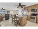 Bright kitchen features stainless steel appliances, granite countertops, and counter seating at 5830 Midnight Pass Rd # 502, Sarasota, FL 34242