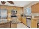 Modern kitchen featuring stainless steel appliances, granite countertops, and bright natural light at 5830 Midnight Pass Rd # 502, Sarasota, FL 34242