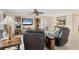 Bright living room with tile flooring, comfortable seating, and a ceiling fan for relaxed living at 5830 Midnight Pass Rd # 502, Sarasota, FL 34242