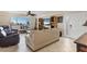 Cozy living room featuring tile floors, comfortable furnishings, and beach views at 5830 Midnight Pass Rd # 502, Sarasota, FL 34242