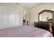 Bedroom featuring a walk in closet, neutral colors, and plush carpet at 6630 Horned Owl Pl, Sarasota, FL 34241