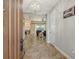 Inviting foyer with tile flooring leading to an open living space and great natural light at 6630 Horned Owl Pl, Sarasota, FL 34241