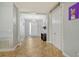 Spacious hallway with tile floors, neutral paint, and access to multiple rooms at 6630 Horned Owl Pl, Sarasota, FL 34241