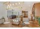 Open floor plan featuring kitchen, dining and living area with modern lighting and neutral tones at 6630 Horned Owl Pl, Sarasota, FL 34241