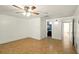This bedroom has neutral walls, ceiling fan, and easy access to the bathroom at 1741 Font Ln, Holiday, FL 34691